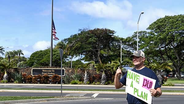 N-PA426-002 PEARL HARBOR Service members rally at the Joint Base Pearl Harbor-Hickam gates to remind drivers to not drink and d