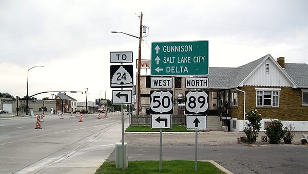 A highway sign at the US-89 and US-50 split marking the junction with Utah State Route 24
