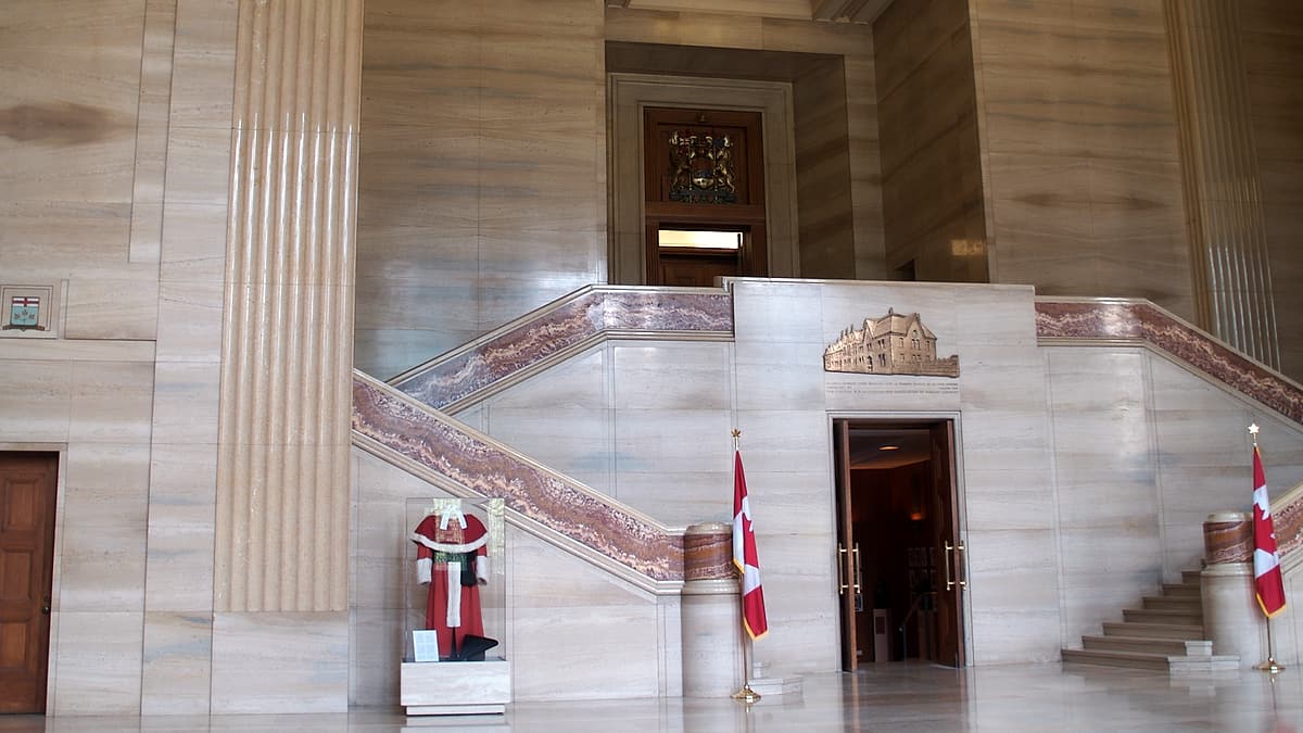The interior of the Supreme Court building in Ottawa, with the bench and counsel tables seen from the public seating
