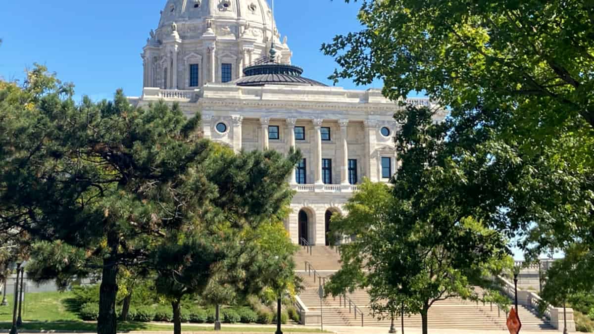 The west entrance of the Minnesota State Capitol, its columned front and dome rising above the approach steps