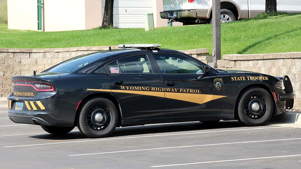 A Wyoming Highway Patrol car parked on a street in Gillette, in the agency's white and dark blue livery
