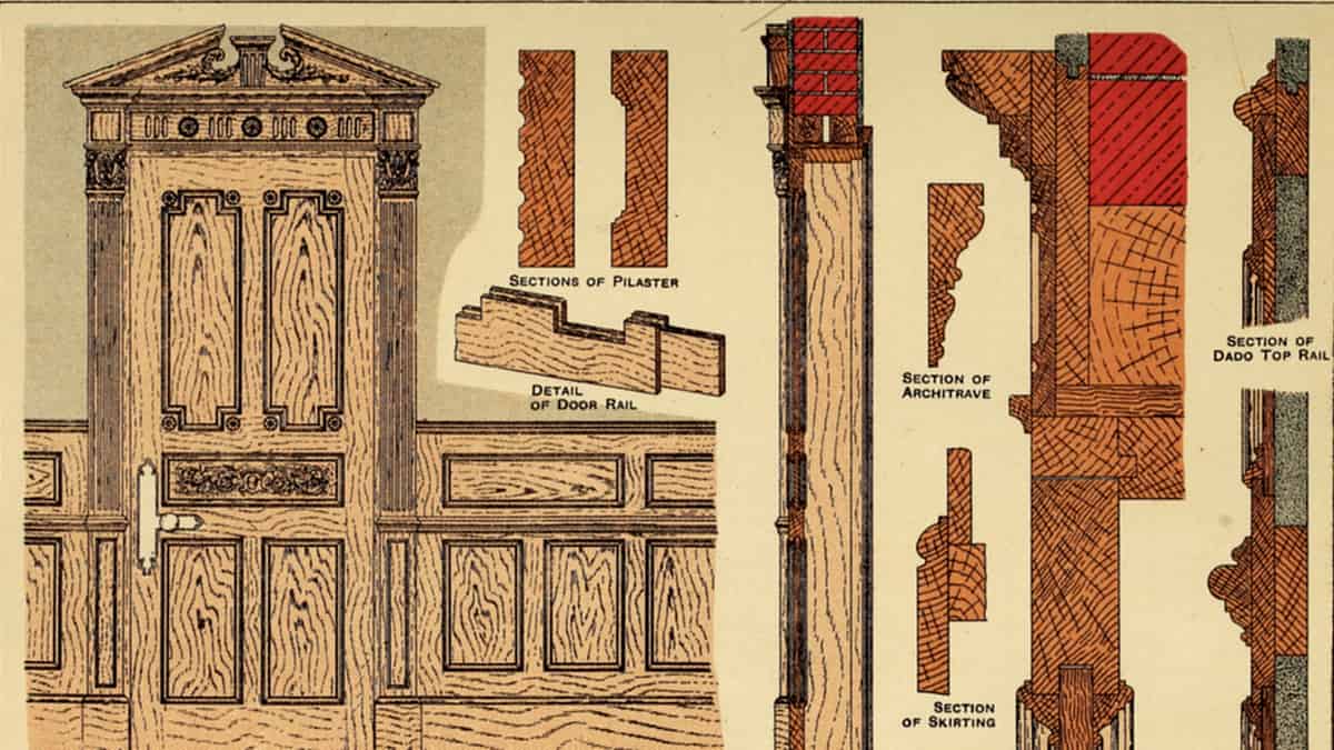 An interior doorway framed in dado carpentry and joinery, standing open onto the room beyond it