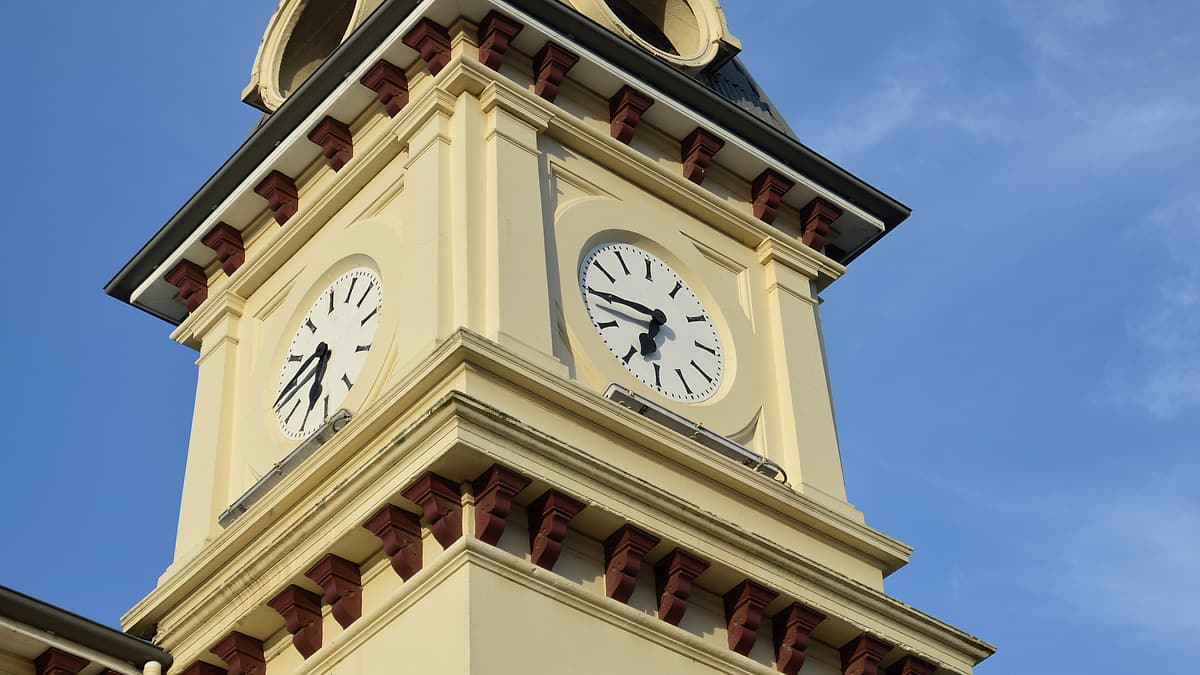 The clock mounted on the front of the post office at Tenterfield, New South Wales, above the street