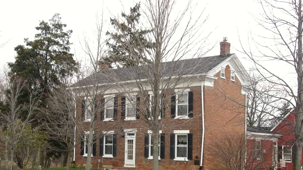 Front and southeastern side of the Lenhart Farmhouse , located at 6929 Piqua Road northeast of Decatur in Root Township , Adams