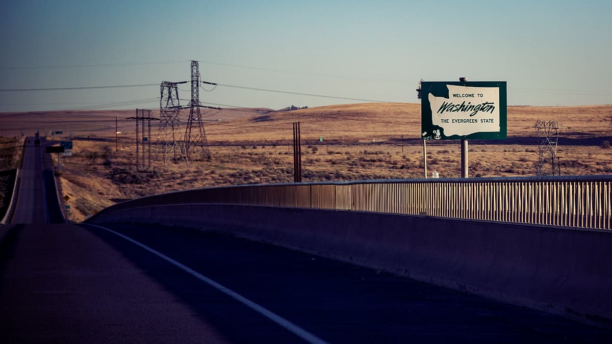 A welcome to Washington state sign on I-82 between Umatilla, Oregon and Plymouth, Benton County, Washington on the